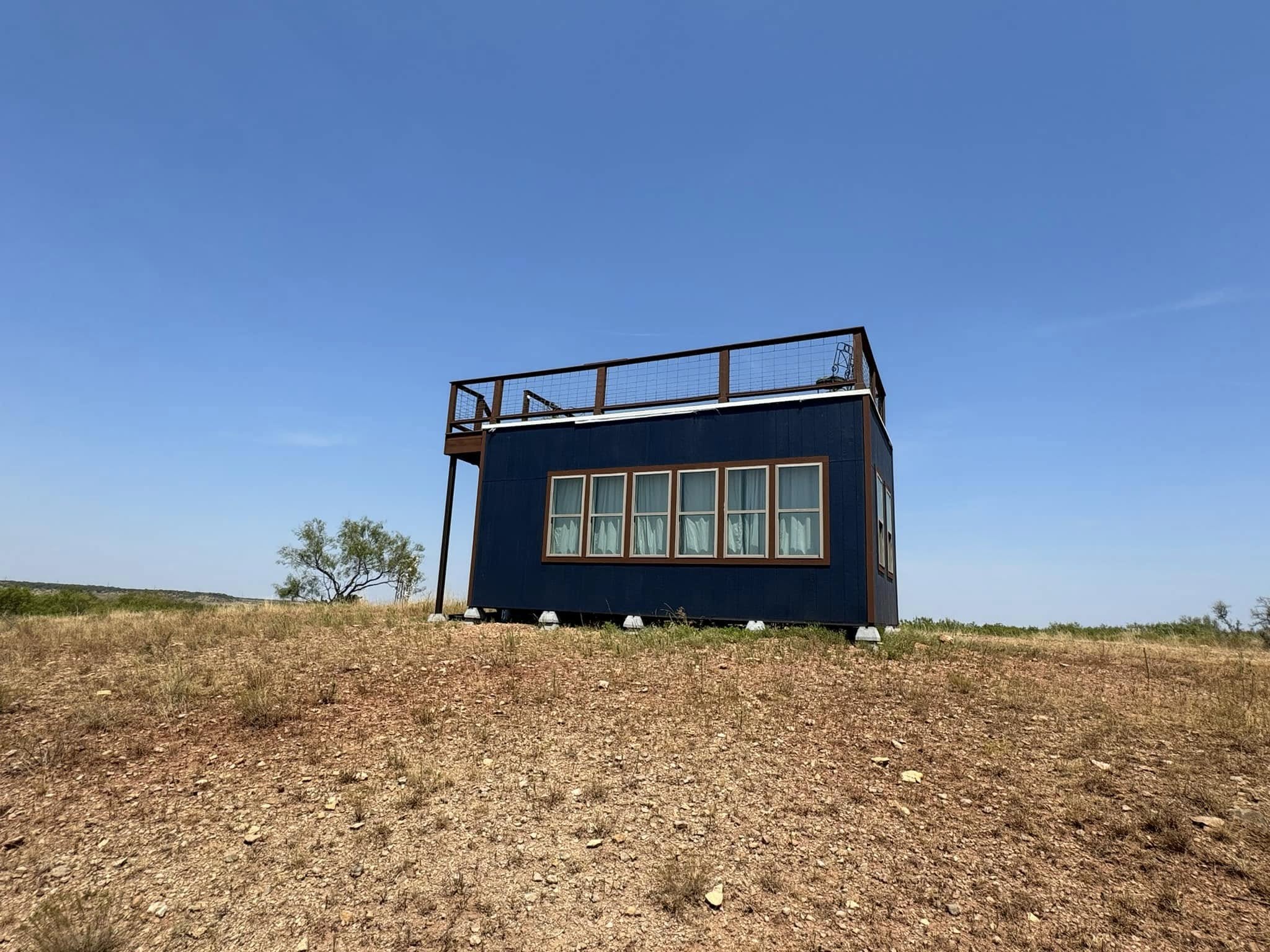 Sunset Cabin perched on a hill at WOW Ranch